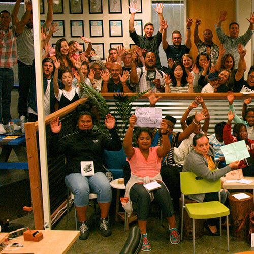 Group of individuals cheering together.